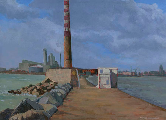 view of the Poolbeg Chimneys belonging to the old power station in Dublin on a grey day. View is from the south great wall looking back towards the city.